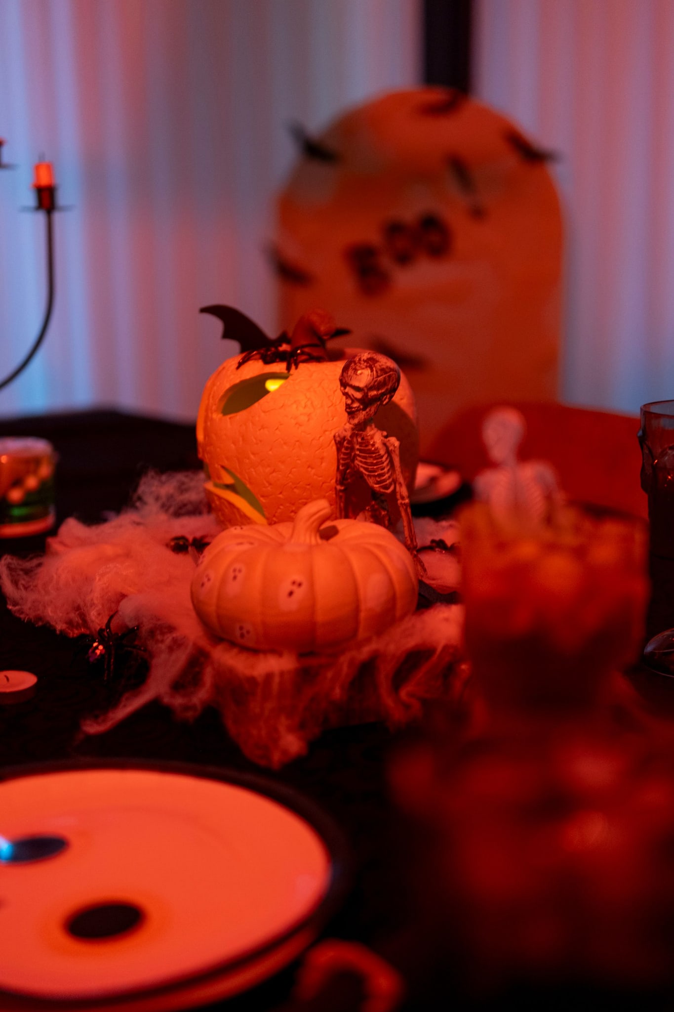 Halloween table with pumpkins and skeleton