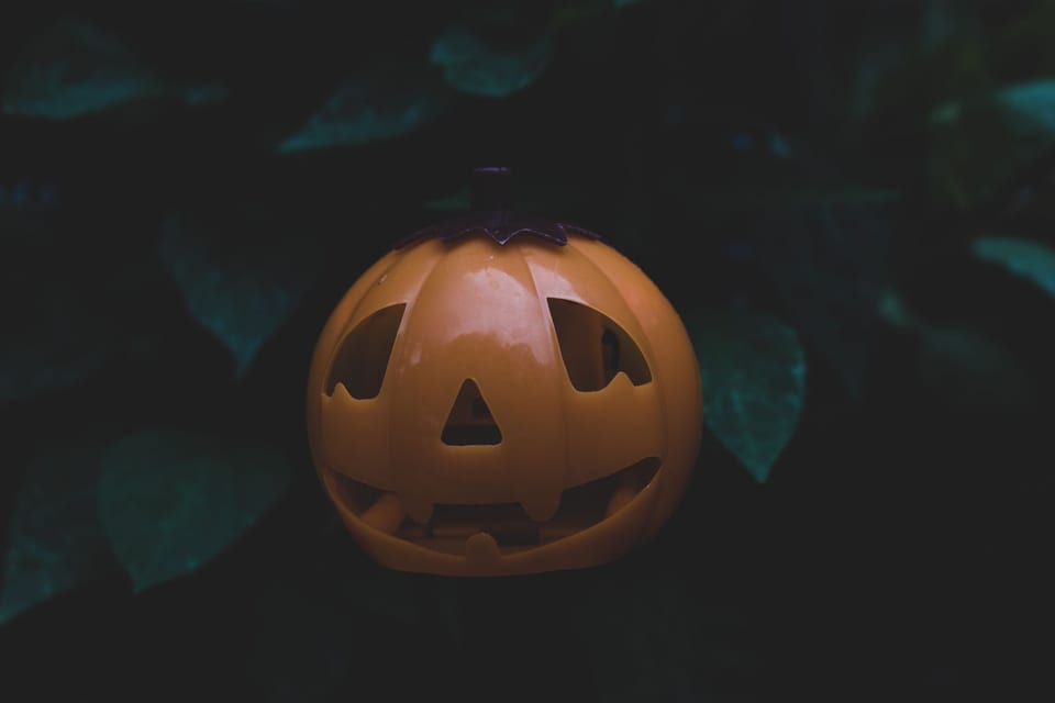 Plastic jack-o'-lantern glowing