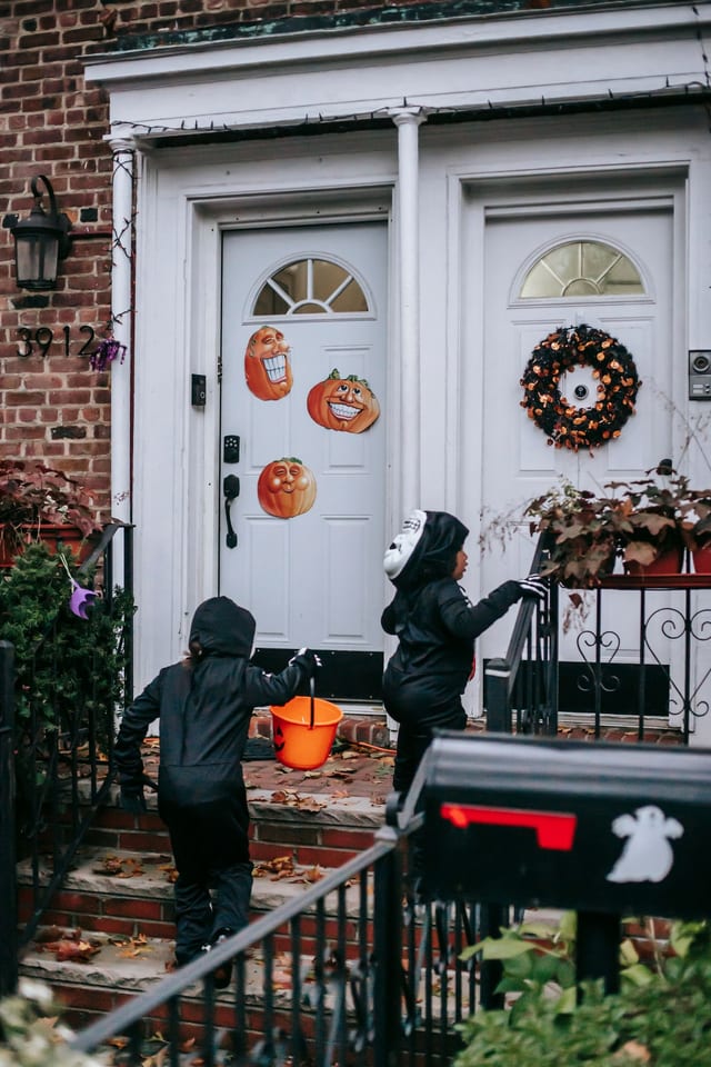 Halloween costumes on house stairs