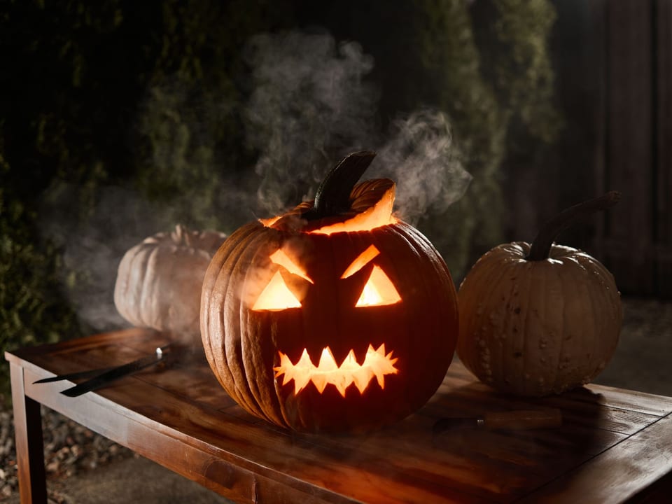 Jack-o'-lantern on wooden table