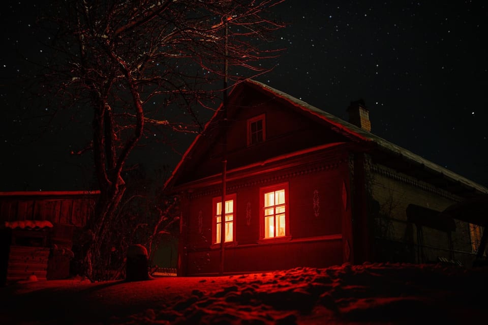 Haunted house with red glowing windows